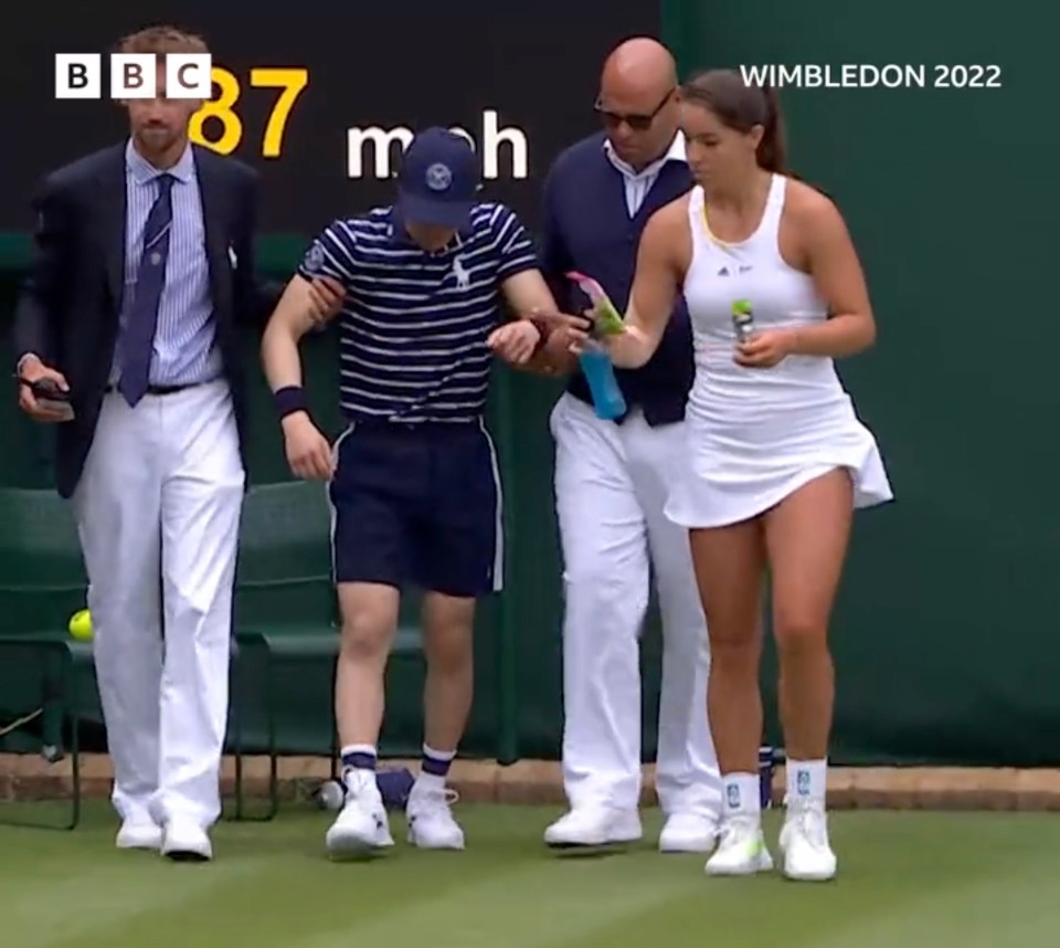 The ball boy could be seen gingerly walking off the court