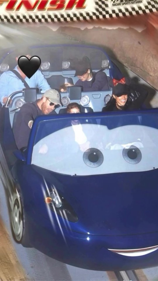 Meghan Markle and Prince Harry with their children on a Disneyland ride.