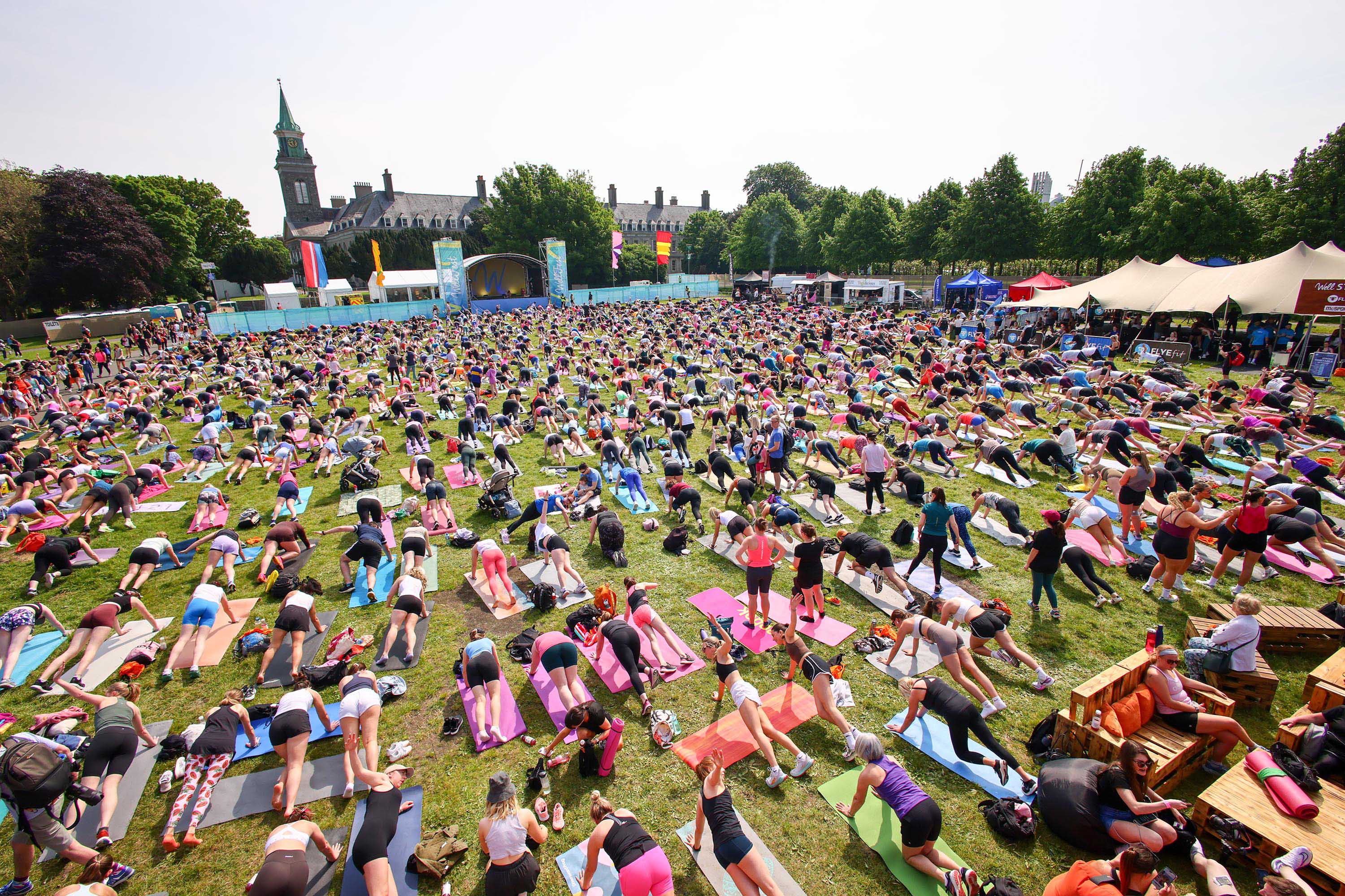 Large group participating in a HIIT workout at WellFest.