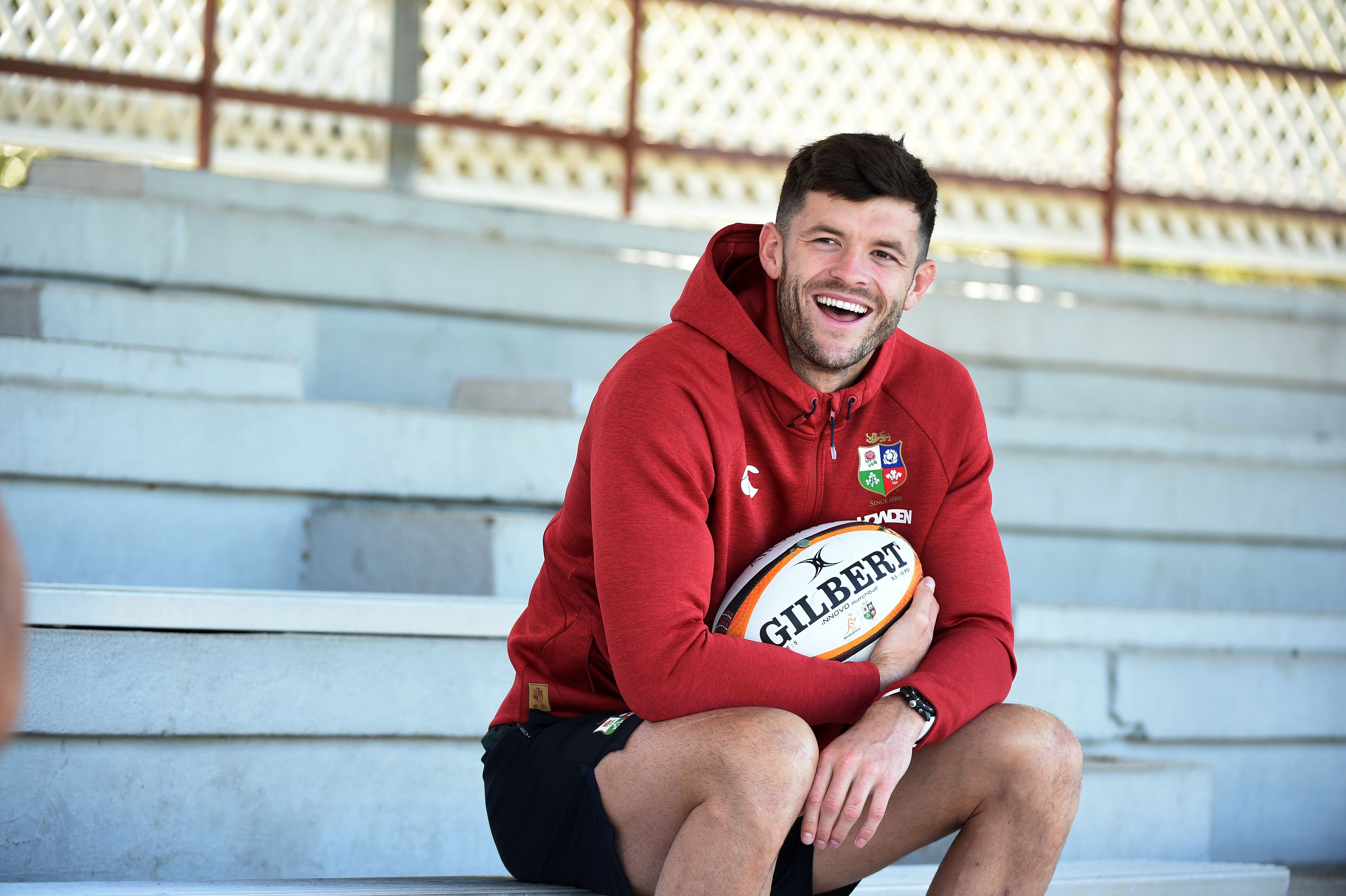 Blair Kinghorn, British & Irish Lions full back, holding a rugby ball.