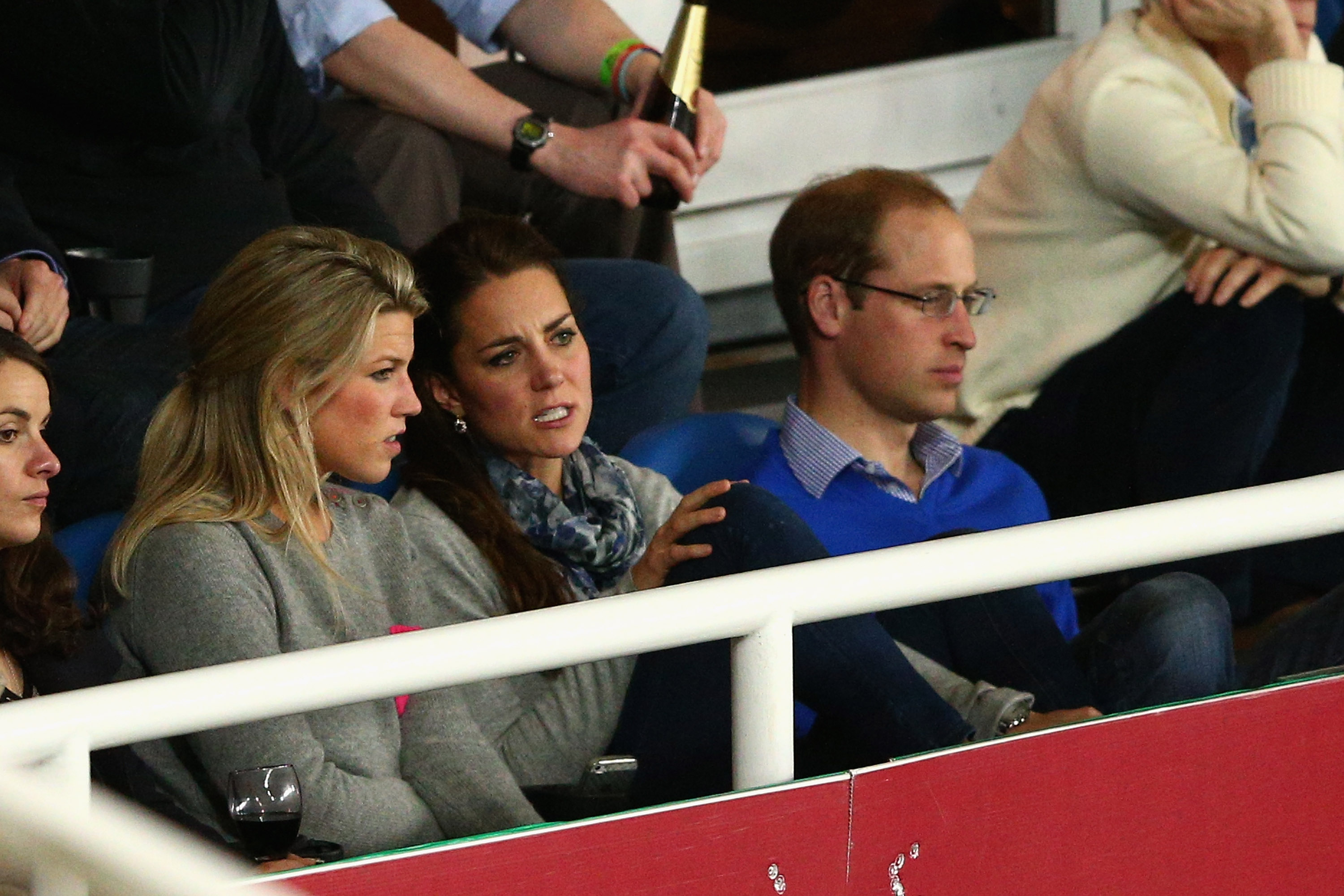 Prince William and Kate Middleton watching a rugby match.