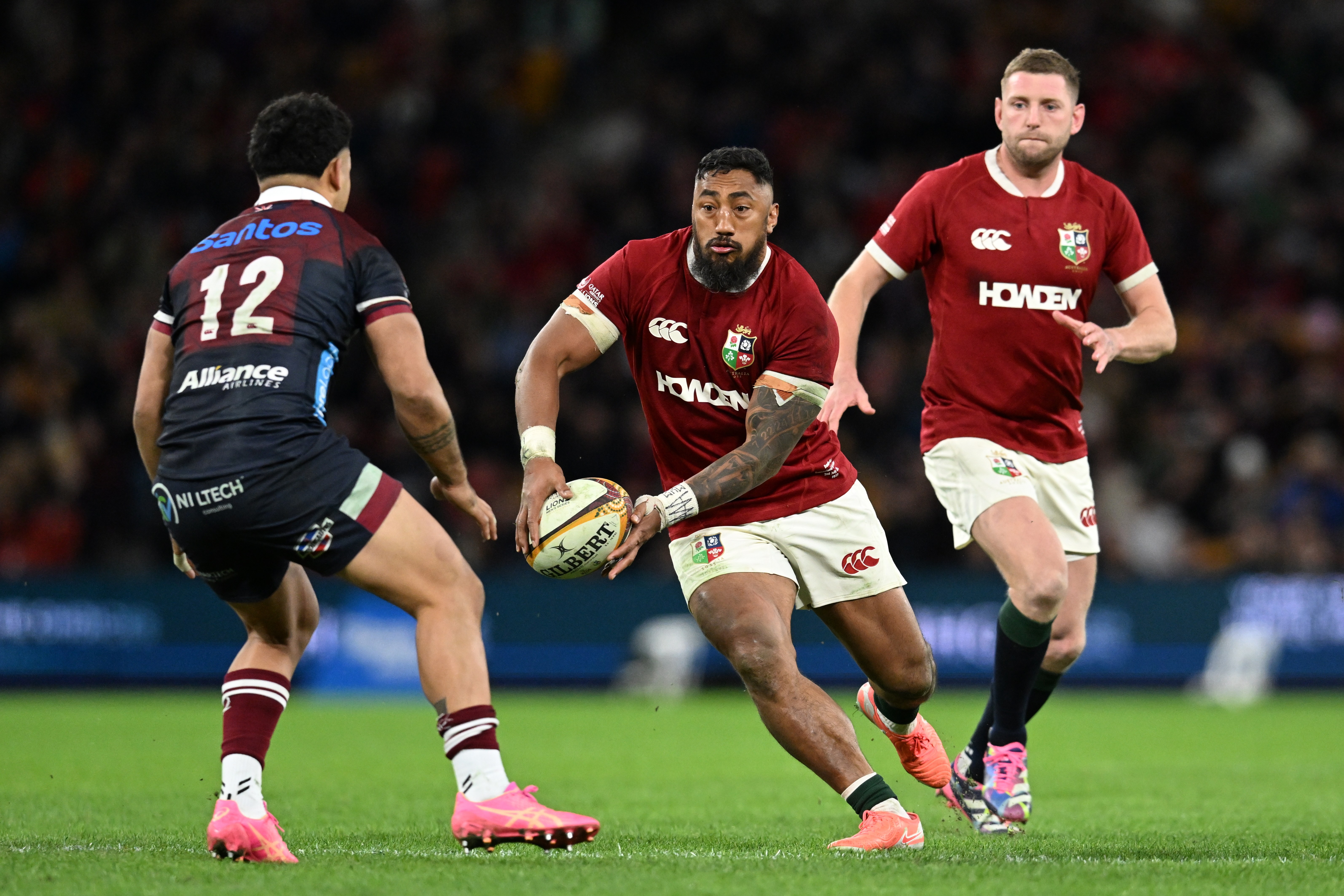 Rugby player Bundee Aki of the British and Irish Lions running with the ball.