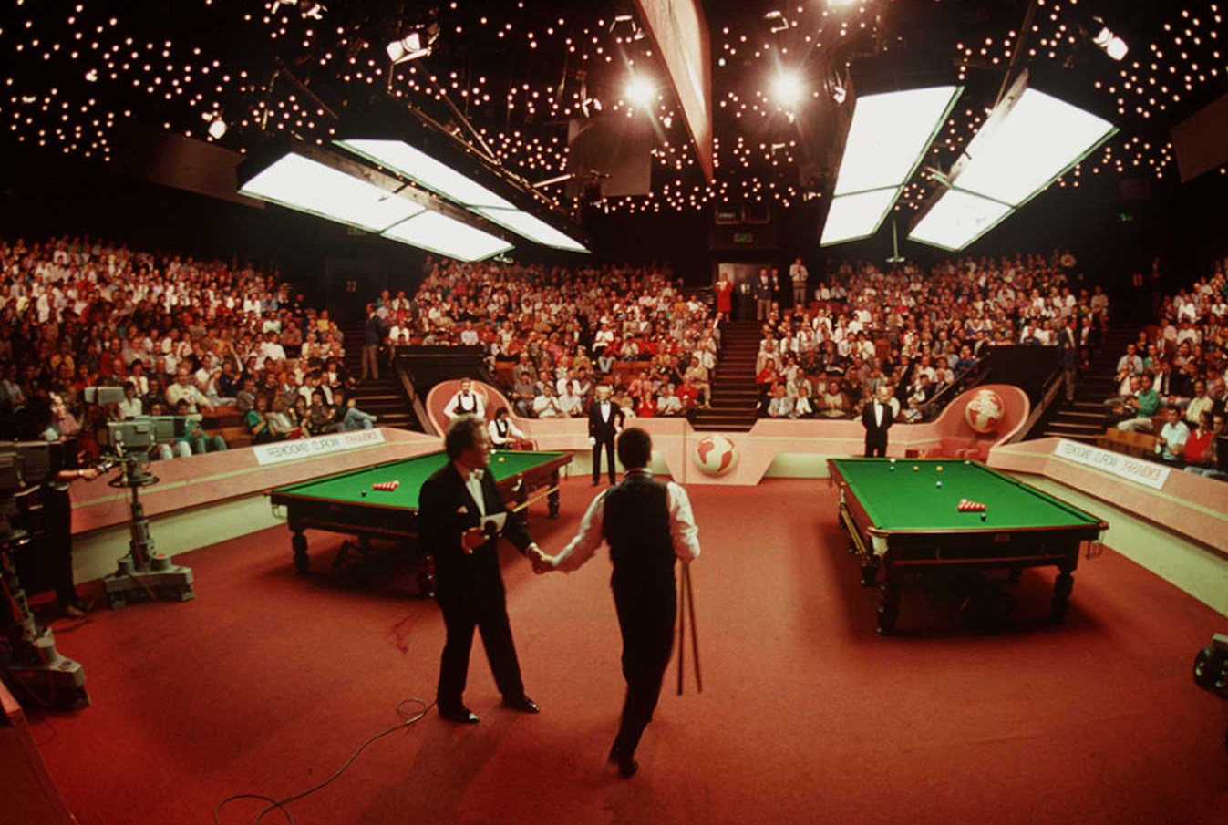 Snooker players shaking hands at the Crucible Theatre in Sheffield.