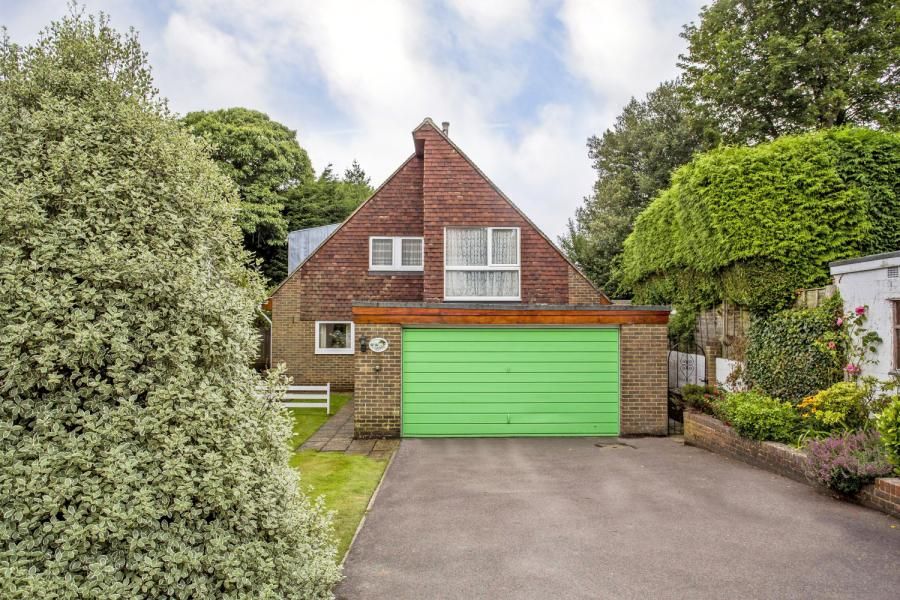 Exterior view of a house with a lime green garage door.