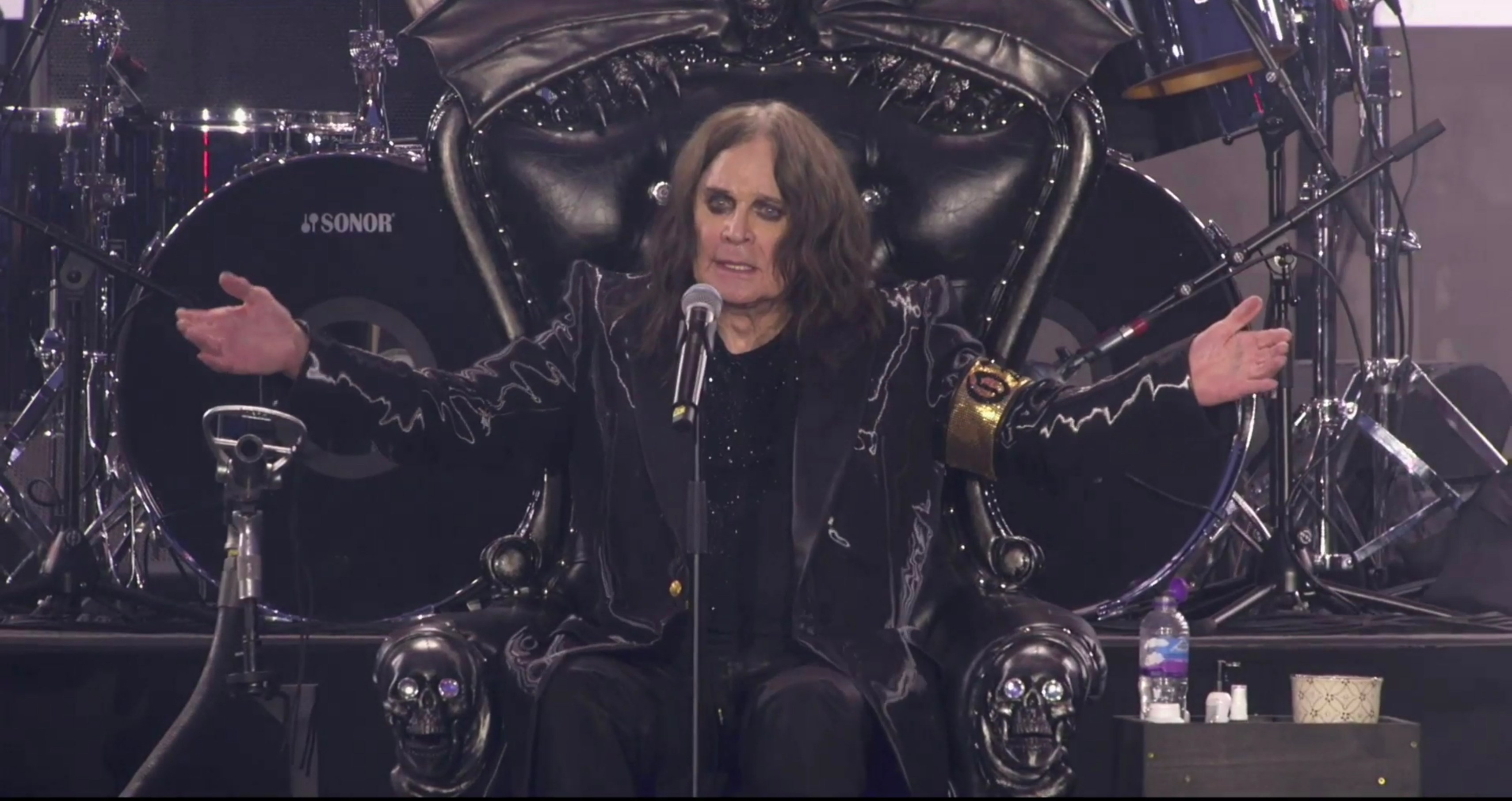 Ozzy Osbourne on stage at a Black Sabbath concert.