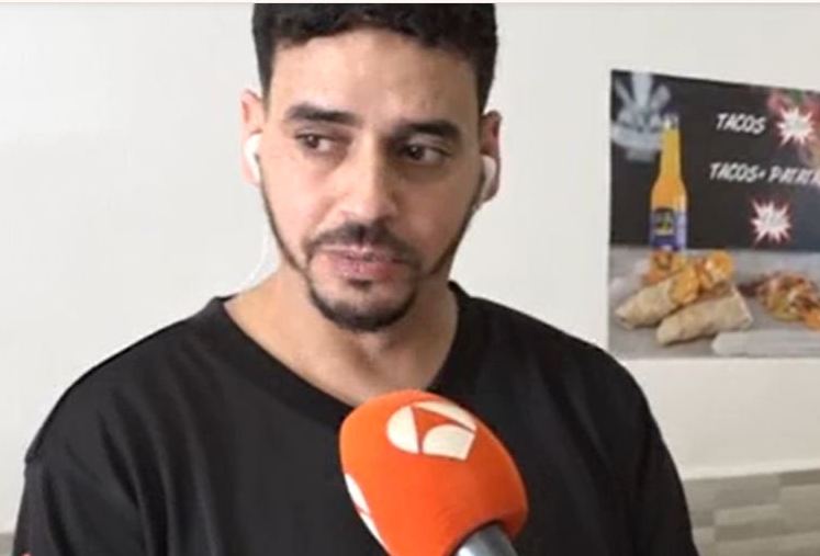 A man being interviewed about the destruction of his kebab restaurant.