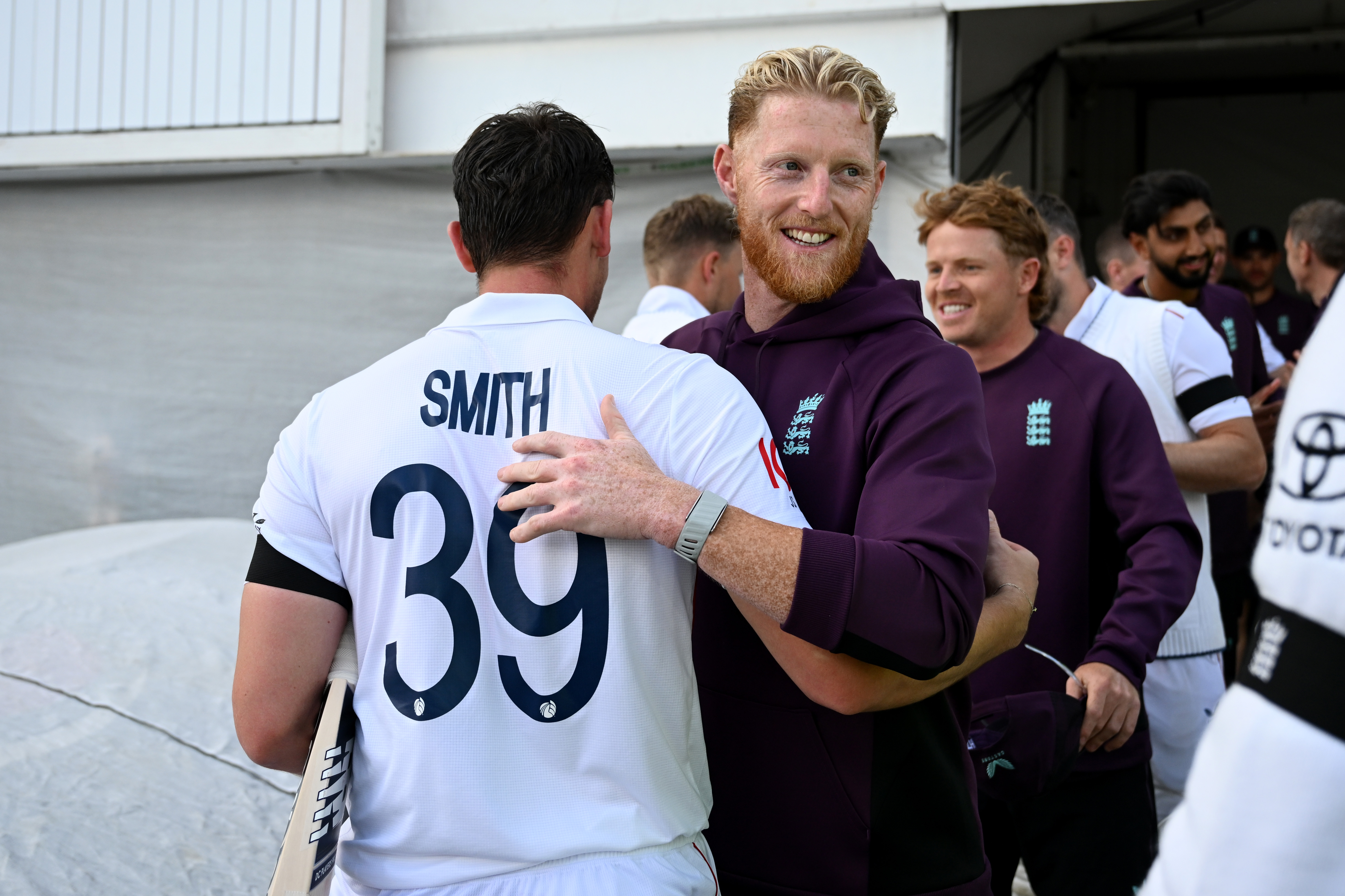 England's Ben Stokes congratulates Jamie Smith after a test match victory.
