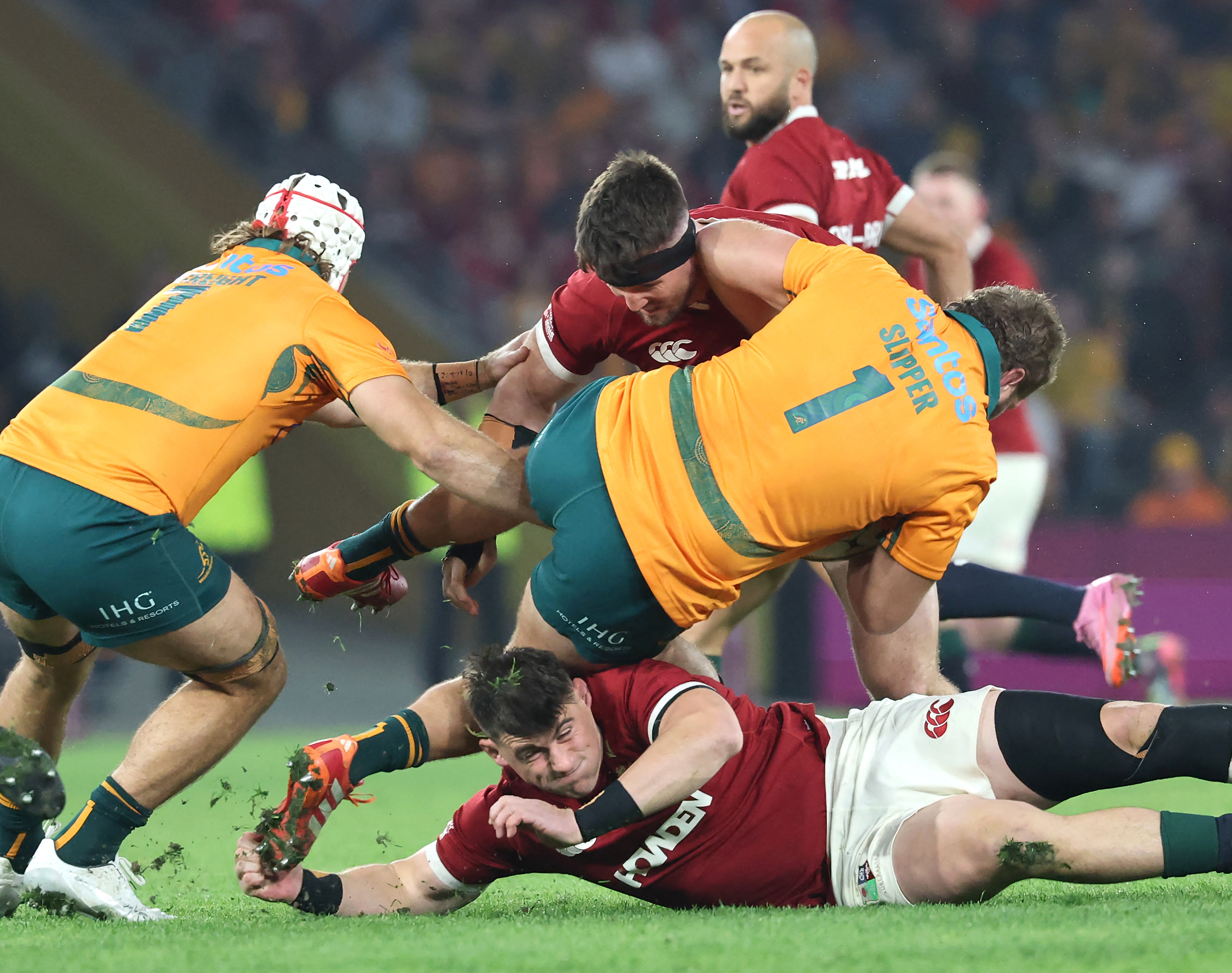 A rugby player is tackled during a match.
