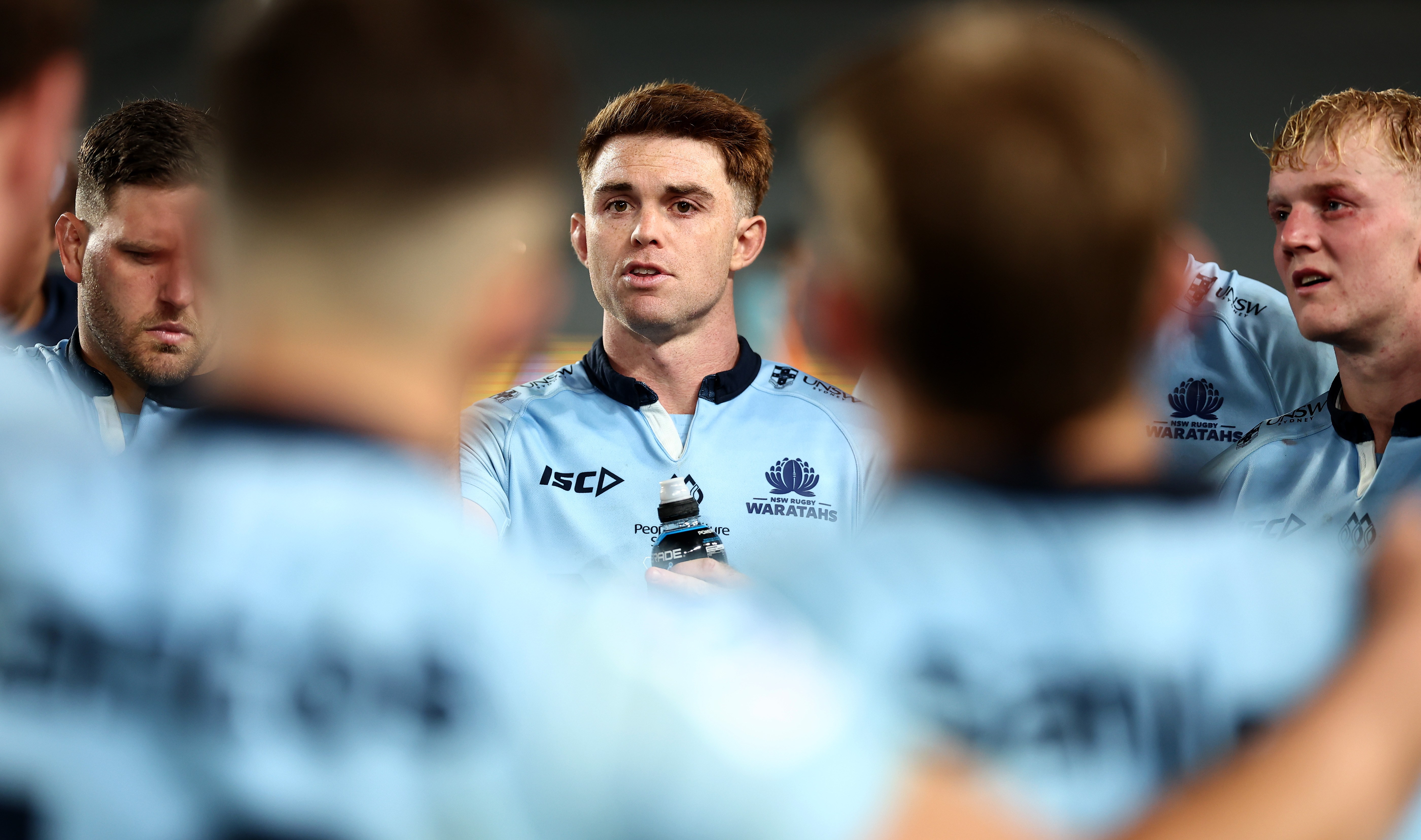Andrew Kellaway of the Waratahs speaks to his team.
