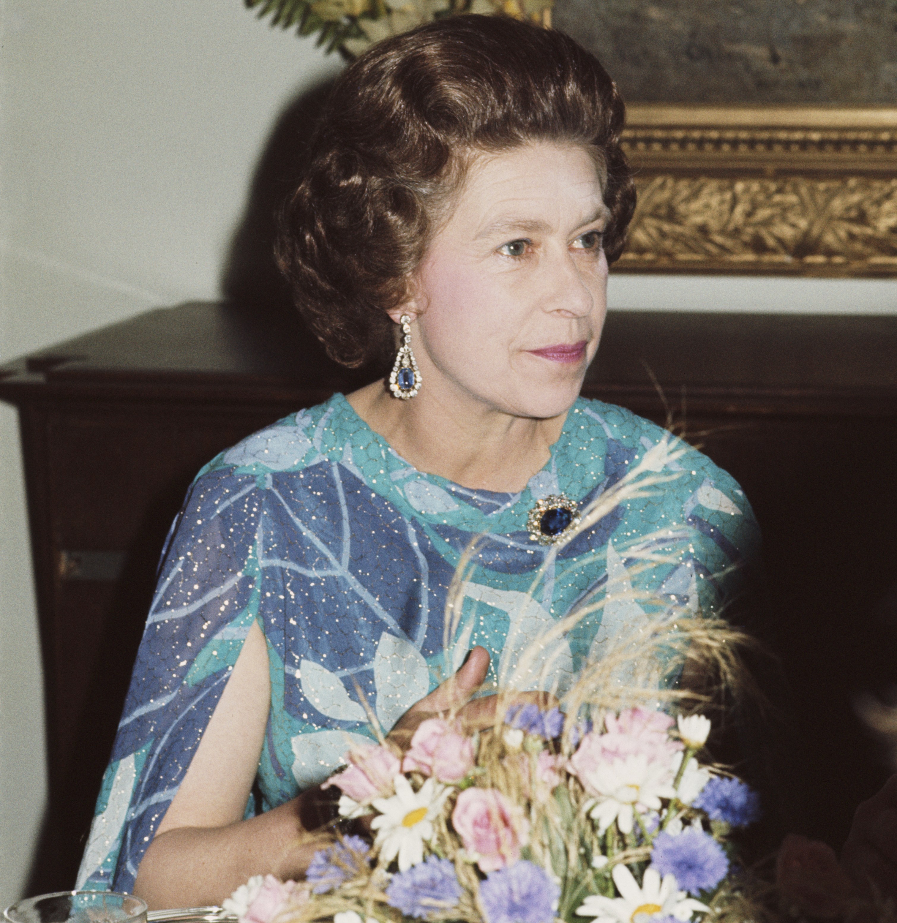 Queen Elizabeth II at a formal dinner.