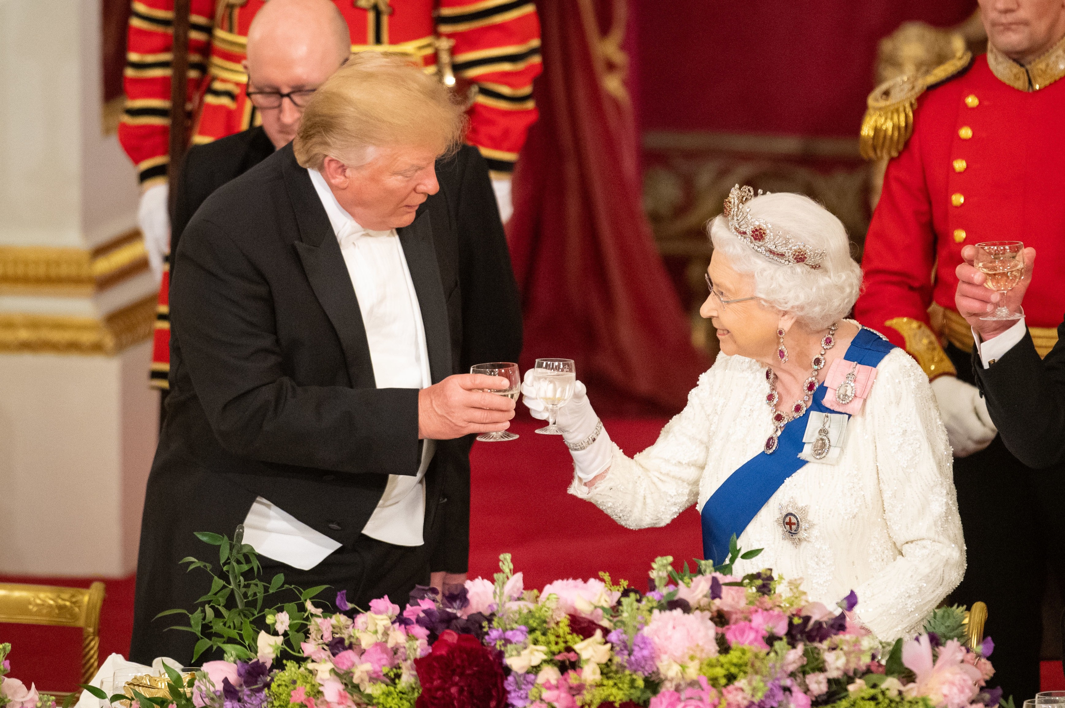 President Trump and Queen Elizabeth II toasting at a state banquet.