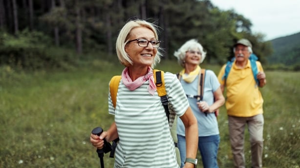 Mature woman enjoying her day in forest with friends