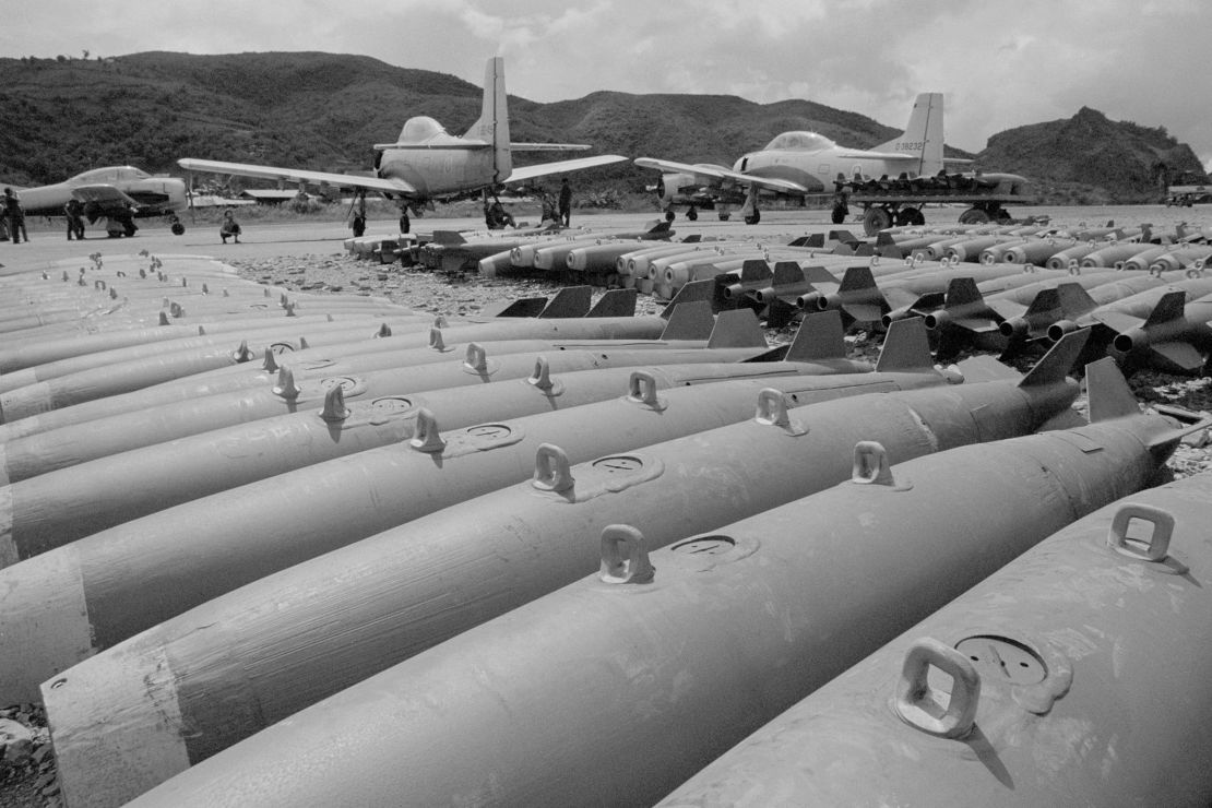 In this image taken in 1972, converted T-28 trainer aircraft stand near 250-pound bombs, part of the air arm of the CIA-sponsored 