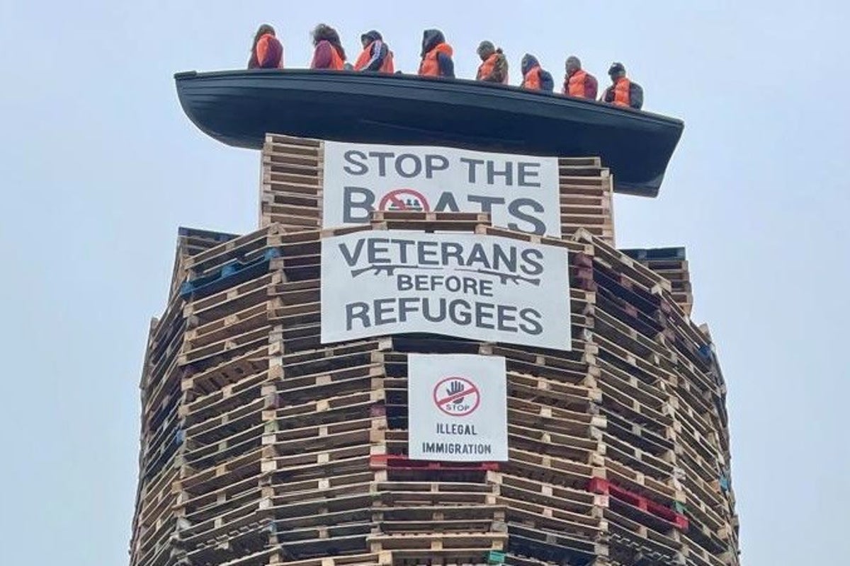 Calls for removal of migrant effigies in boat on loyalist bonfire in Northern Ireland