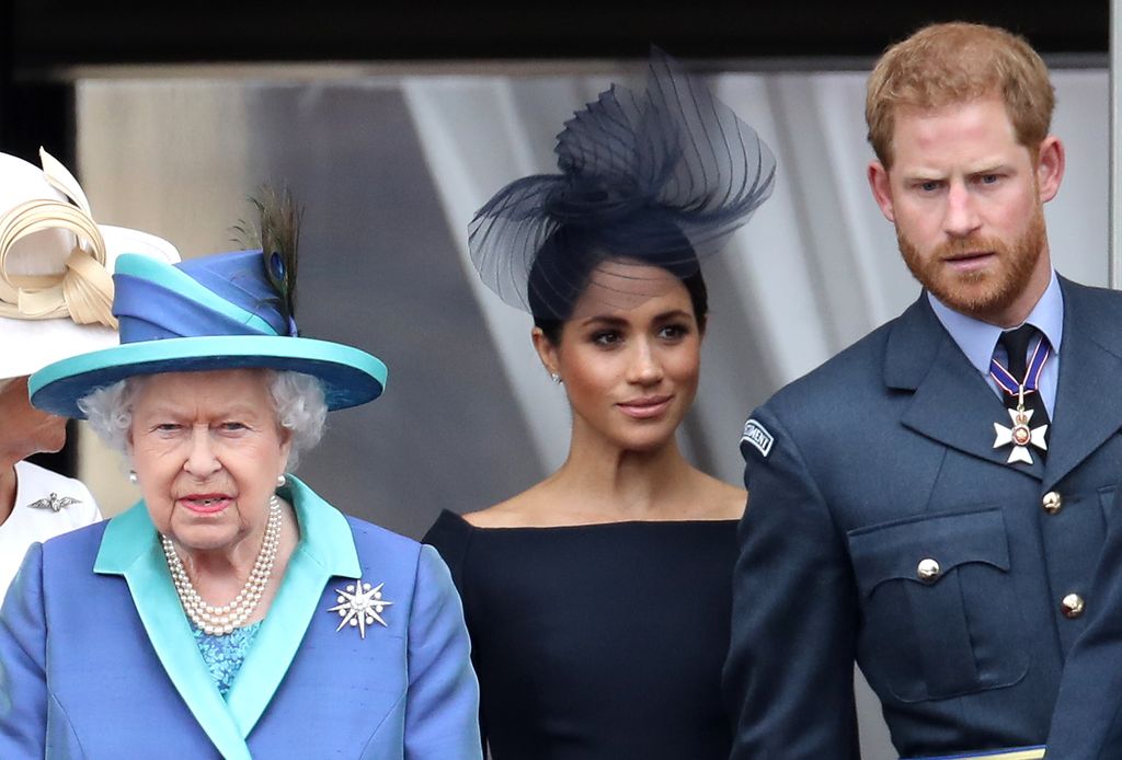 Queen Elizabeth II, Prince Harry and Meghan Markle on the balcony of Buckingham Palace