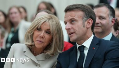 Brigitte and Emmanuel Macron pictured at a public event in London earlier this month, seated and leaning towards each other