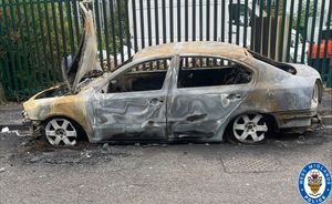 The burned out car