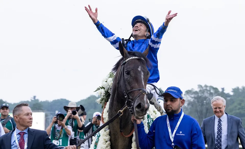 Neil Poznansky (left) helps lead Sovereighty into the Saratoga winner's circleWalter Wlodarczyk&sol;NYRA photo
