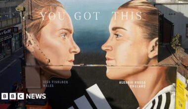 A mural painting on a side of the wall featuring the two football players, Jessica Fishlock and Alessia Russo. It shows their faces in profile, facing each other. Their hair is tied back and their football shirts are just visible at the bottom of the mural.