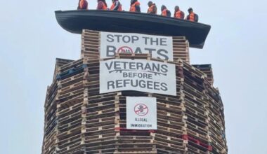 Calls for removal of migrant effigies in boat placed on loyalist bonfire in NI
