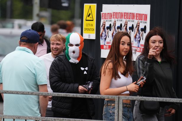 Fans dressed up queued for the gig