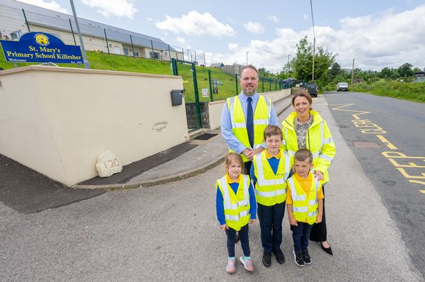 Infrastructure Minister Liz Kimmins at St Mary’s Primary School, Killesher with School Principal John Cunningham and pupils.