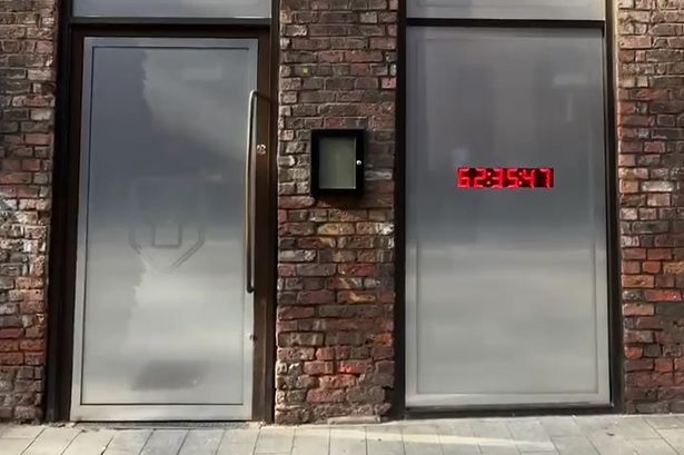 A countdown clock shows shoppers when Classic Football Shirts will open in Liverpool
