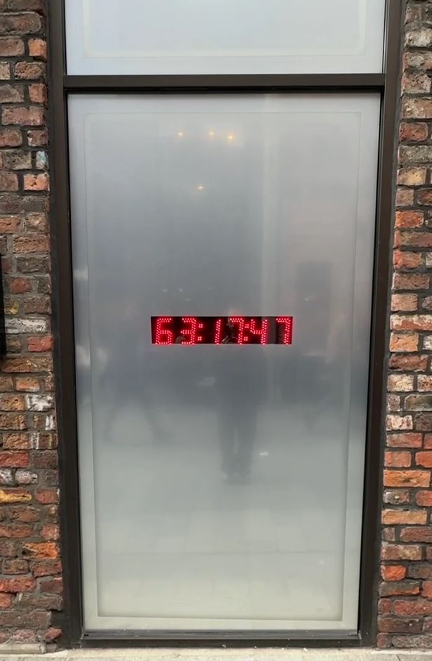 A countdown clock shows shoppers when Classic Football Shirts will open in Liverpool