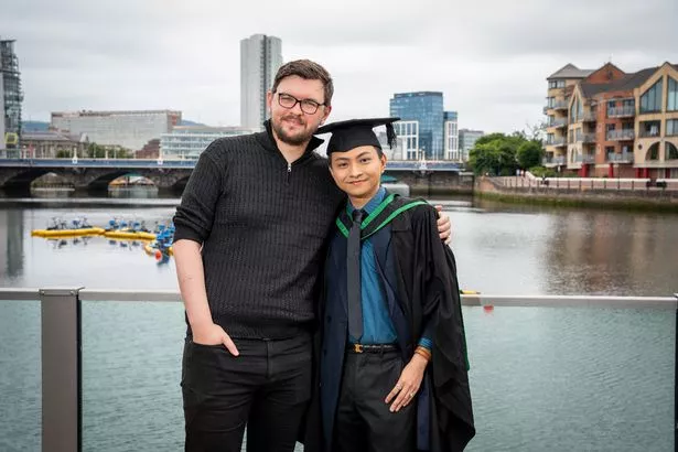 Yuan Zhang on his graduation day with his husband Gary