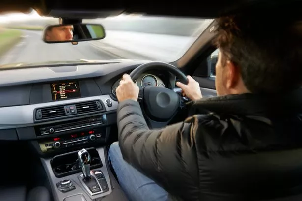 Man driving right-hand-drive car.