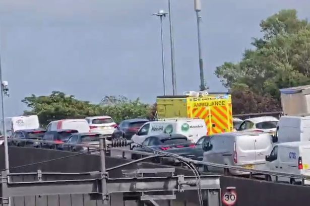 Three ambulances were seen trying to get through the traffic going onto the M62