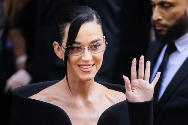 Katy Perry in a black dress.