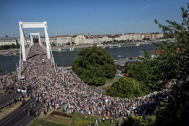 Participants cross the  Elisabeth Bridge during the Budapest Pride on June 28, 2025 in Budapest, Hungary.