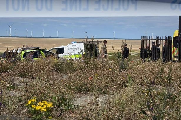Police and bomb disposal team on Hoylake promenade and beach after an unexploded bomb was discovered 