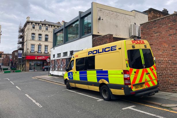 A Merseyside Police van parked on Roscoe Street, near to the Bombed Out Church, on Sunday