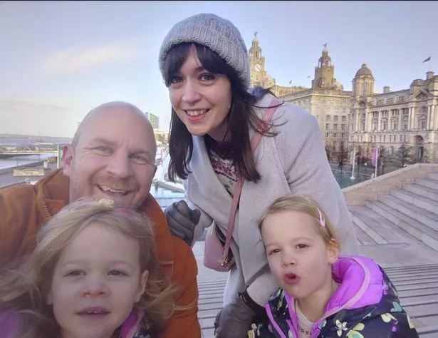 Elaine Sykes pictured with husband Jack and their twin daughters Florence and Lily 