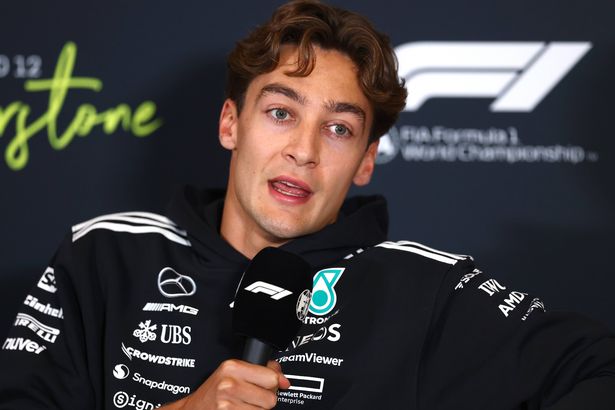 George Russell of Great Britain and Mercedes AMG Petronas F1 Team looks on during previews ahead of the F1 Grand Prix of Great Britain at Silverstone Circuit