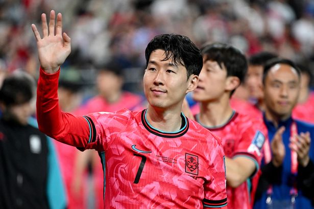 Son Heung-min waving after South Korea's win against Kuwait