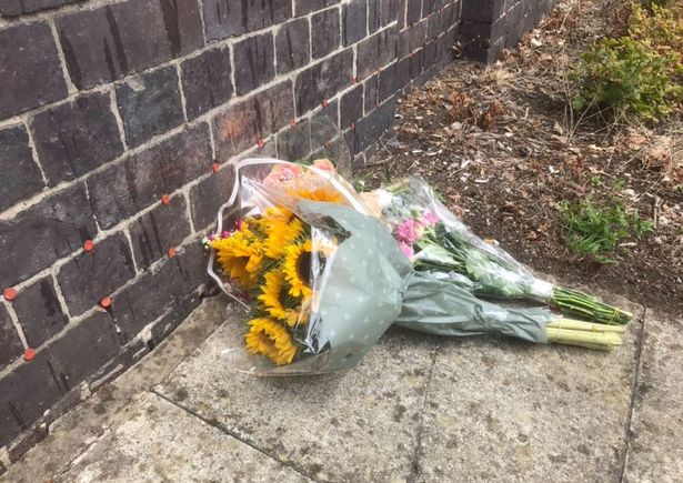 Flowers were left at the station the following morning