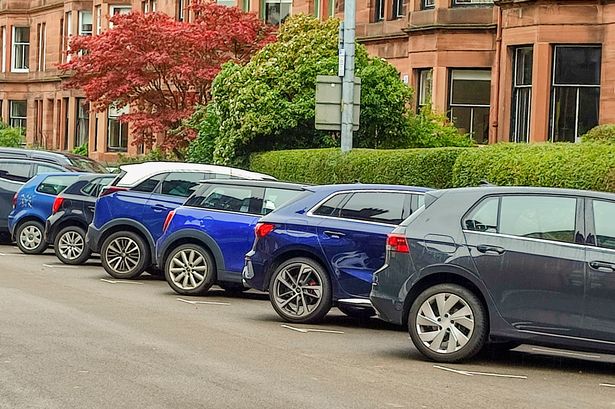 Cars parked atstreet of  glasgow scotland england UK