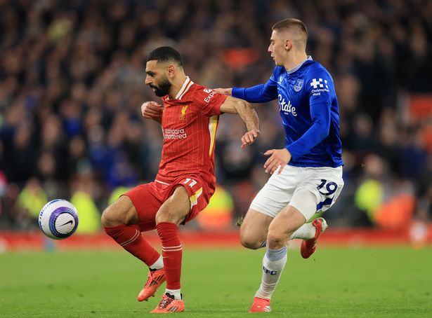 LIVERPOOL, ENGLAND - APRIL 02: Mohamed Salah of Liverpool is challenged by Vitaliy Mykolenko of Everton during the Premier League match between Liverpool FC and Everton FC at Anfield on April 02, 2025 in Liverpool, England. (Photo by Carl Recine/Getty Images)