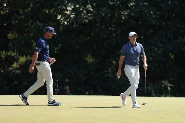 Bryson DeChambeau of the United States and Rory McIlroy of Northern Ireland walk on the fifth green during the final round of the 2025 Masters Tournament at Augusta National Golf Club on April 13, 2025 in Augusta, Georgia