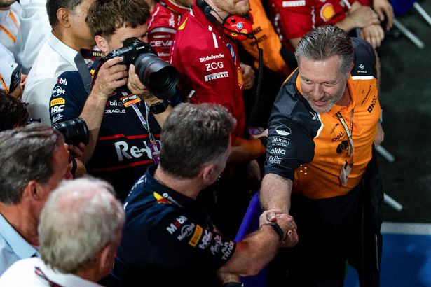 McLaren CEO Zak Brown shakes the hand of Red Bull Racing CEO and Team Principal Christian Horner in parc ferme during the F1 Grand Prix of Saudi Arabia at Jeddah Corniche 