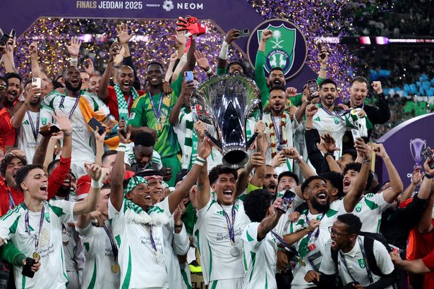 Roberto Firmino of Al-Ahli Saudi lifts The AFC Champions League Elite trophy