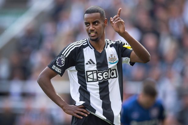 Alexander Isak of Newcastle United points and looks on