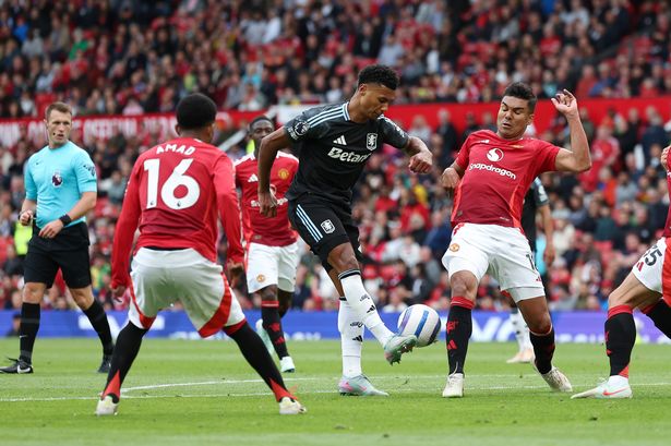 Ollie Watkins unleashes a shot for Aston Villa against Manchester United at Old Trafford.