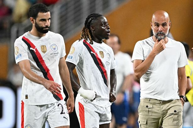 Pep Guardiola looks on following Man City's Club World Cup exit
