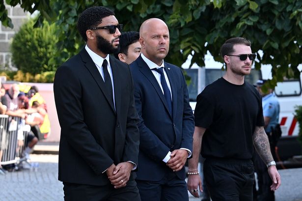 Arne Slot, Manager of Liverpool FC, arrives with players and coaching staff at a funeral held for Diogo Jota