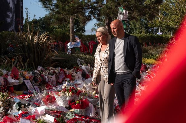 LIVERPOOL, ENGLAND - JULY 08: Arne Slot, head coach and his wife paying tribute to Diogo Jota at Anfield on July 08, 2025 in Liverpool, England. The Liverpool player and Portugal international Diogo Jota, 28,  was killed in a car crash on July 03 in Zamora, Spain. He was travelling with his brother Andre Silva before returning to the UK for the start of the Premier League season. (Photo by Nikki Dyer - LFC/Liverpool FC via Getty Images)