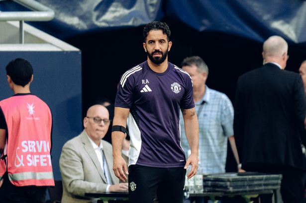 Ruben Amorim stands on the touchline.